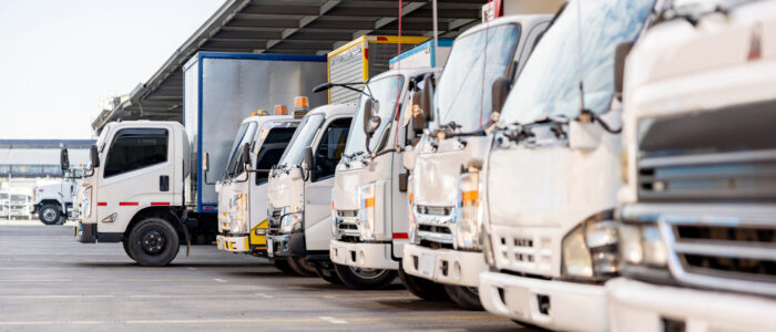 Trucks parked in a distribution warehouse ready to deliver some cargo
